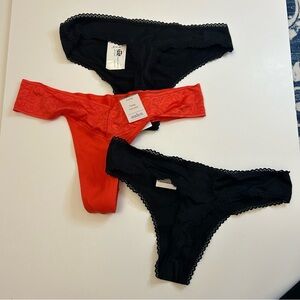 73.  Auden Black and orange women’s  thong panties size small